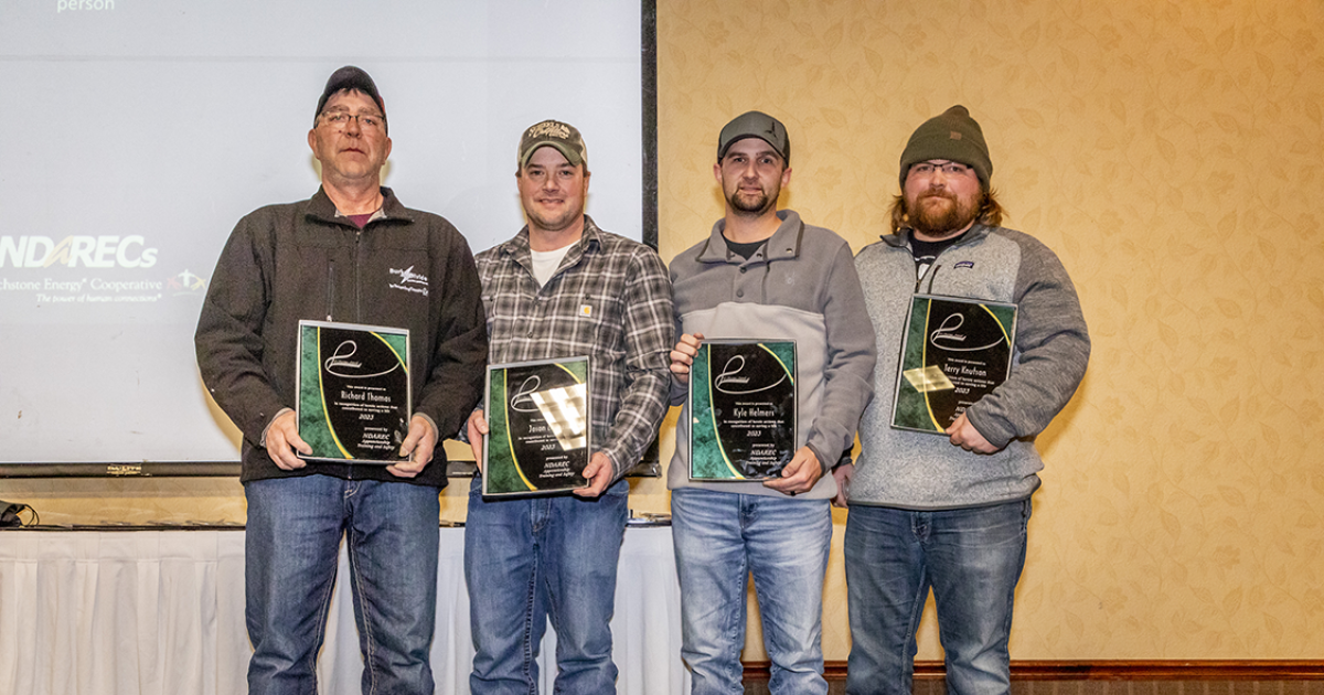On Jan. 11, the North Dakota Association of Rural Electric Cooperatives presented (from left) Joe Thomas, Jason Bruner, Kyle Helmers and Terry Knutson with the Life Saver Award.