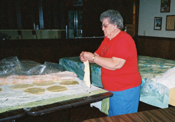 In this 2005 photo, Emma Speidel, of Ashley, delicately stretches strudel dough, which could be considered a German-Russian art form. Emma passed away in 2013. PHOTO COURTESY SANDY BRUNSON