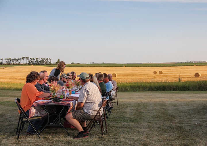 Diners enjoy food and conversation at gardendwellers FARM’s annual farm-to-table dinner. Courtesy PHOTO