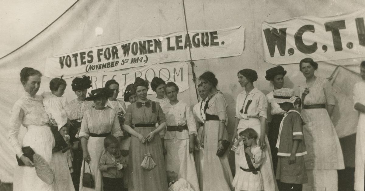 Women and children gather outside a Votes for Women League and Woman's Christian Temperance Union tent at a 1914 county fair in Bottineau. STATE HISTORICAL SOCIETY OF NORTH DAKOTA, 10204-00005