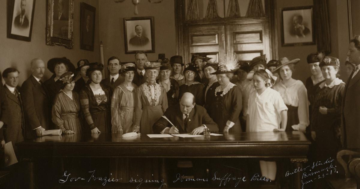 Gov. Lynn Frazier signs the 1917 women's suffrage bill, allowing women to vote for president of the United States and a variety of county and municipal offices, but not for governor or legislative seats. STATE HISTORICAL SOCIETY OF NORTH DAKOTA, CO278-00001