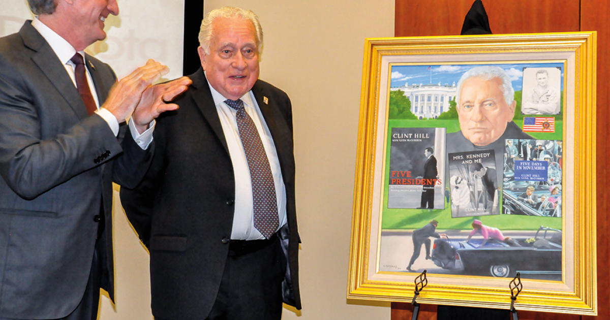 Clint Hill accepts the accolades of Gov. Doug Burgum, and hundreds of well-wishers, upon the unveiling of his official portrait, which will be added to the Theodore Roosevelt Rough Rider Hall of Fame gallery in the state Capitol in Bismarck. NDAREC PHOTO/KENT BRICK