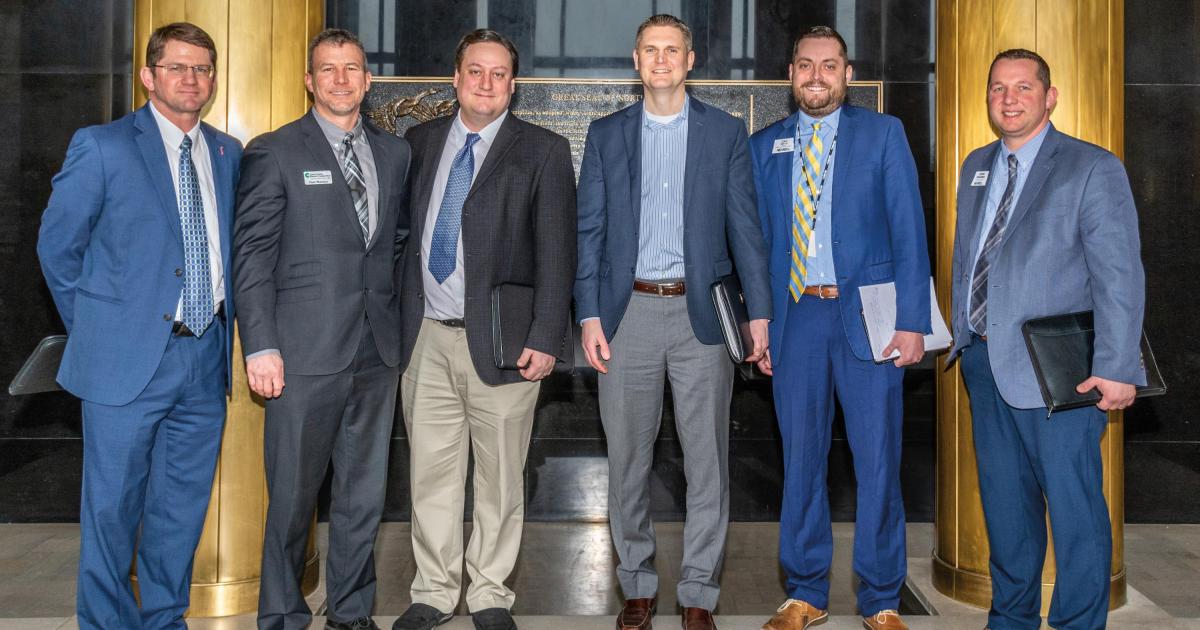 Electric cooperative leaders stand for a photo in the North Dakota State Capitol Great Hall following a February 2019 legislative hearing on SB 2322, from left: Chris Baumgartner, Basin Electric Power Cooperative; Paul Matthys, Cass County Electric Cooperative; Tom Rafferty, Verendrye Electric Cooperative; Paul Fitterer, Capital Electric Cooperative; Zac Smith and Josh Kramer, NDAREC. NDAREC and member cooperatives opposed the bill, which was defeated in the Senate by a 7-39 vote.