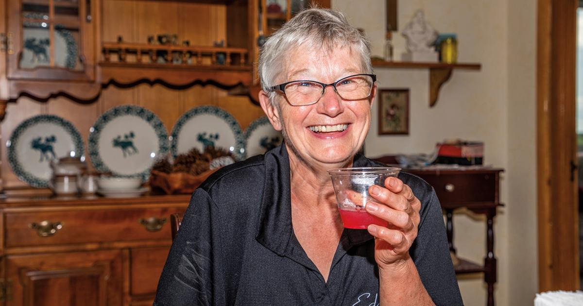 Edgeley Public Schools head cook Joanne Geinert sips rhubarb punch – a family-favorite recipe – at her home in rural Nortonville. Photo by NDAREC/Liza Kessel