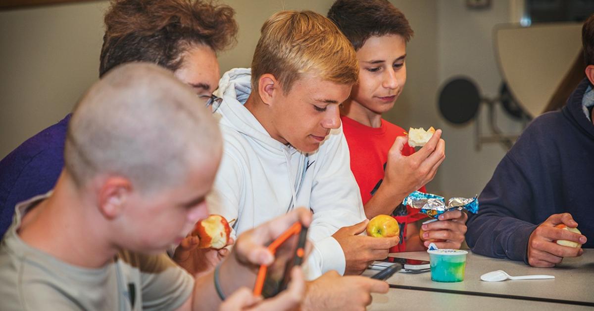 Students enjoy a snack in the Bismarck High School lunchroom during a recent summer program. Photos by NDAREC/Liza Kessel