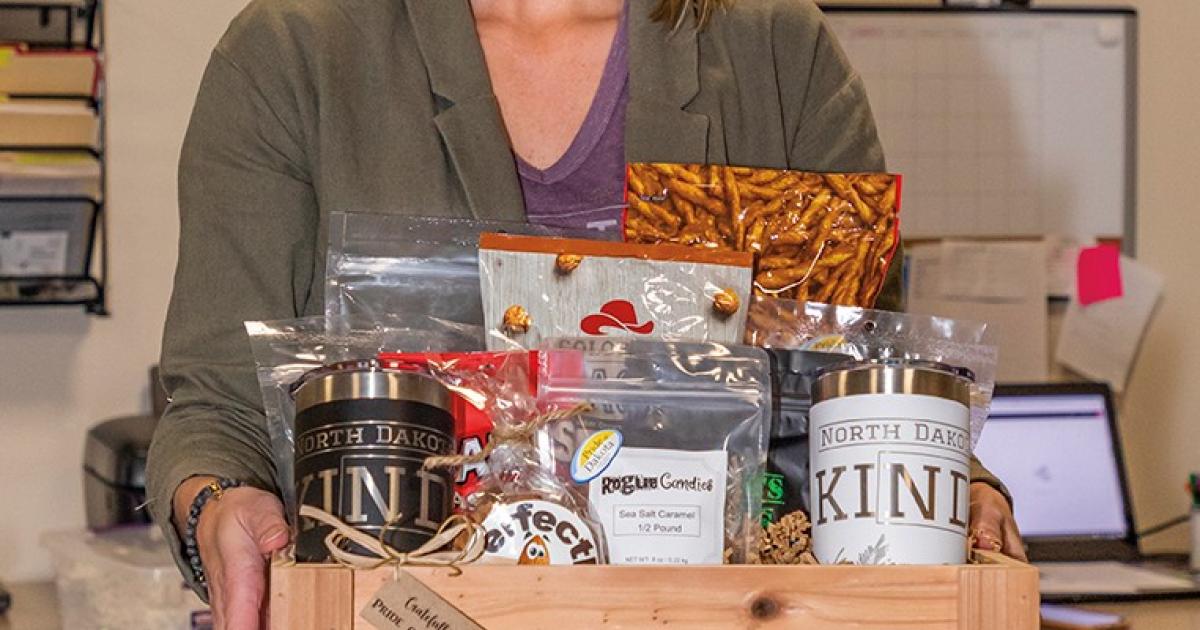 Dani Gilseth holds a sample Crateful of North Dakota-themed products.