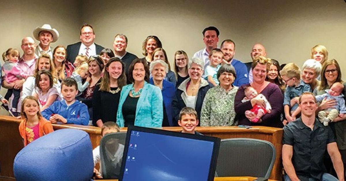 Chad and Erin Oban celebrate legally becoming parents with a courtroom full of family and friends in April 2017.