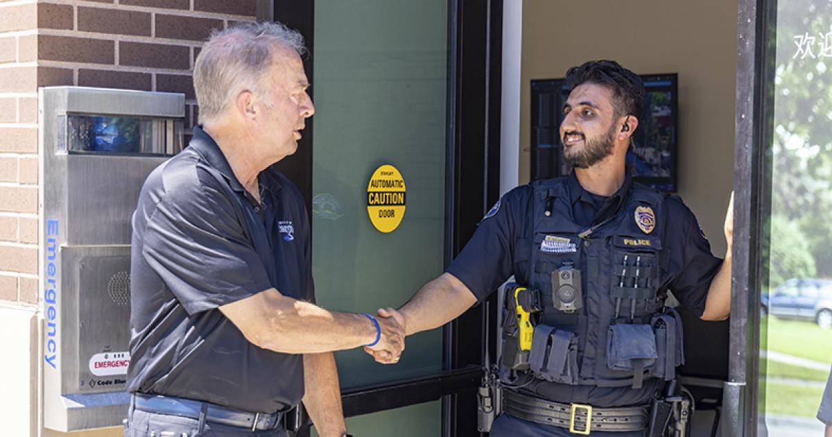 Mayor Tim Mahoney and Police Officer Shoaib Sulaivani