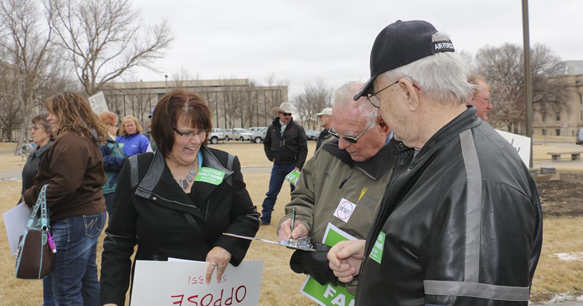 Lori Carlson gathers signatures