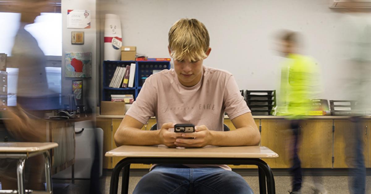 student with cellphone