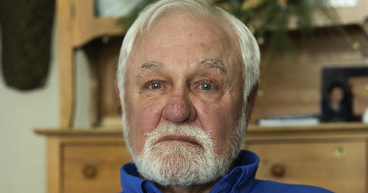 Vietnam War veteran Denny McKechnie of Westhope holds a photo of soldiers he served with and the stray dog they adopted. All of the men in the photo survived the war. Photos by NDAREC/Kennedy DeLap Vietnam War veteran Denny McKechnie