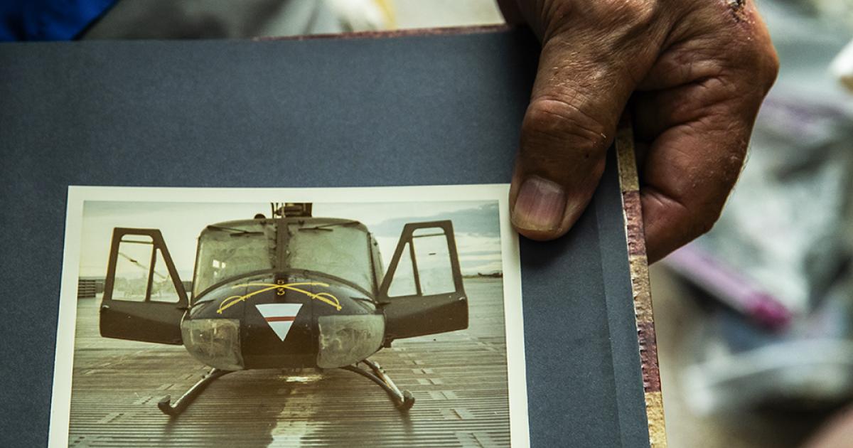 Denny McKechnie painted the triangle and cross sabers across the nose of his UH-1H Huey helicopter in Vietnam. UH-1H Huey helicopter