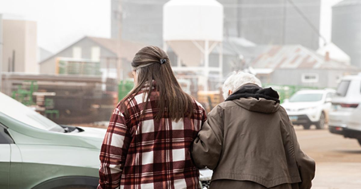 Andi Diaz Gonzalez walks 95-year-old Leona Staiger