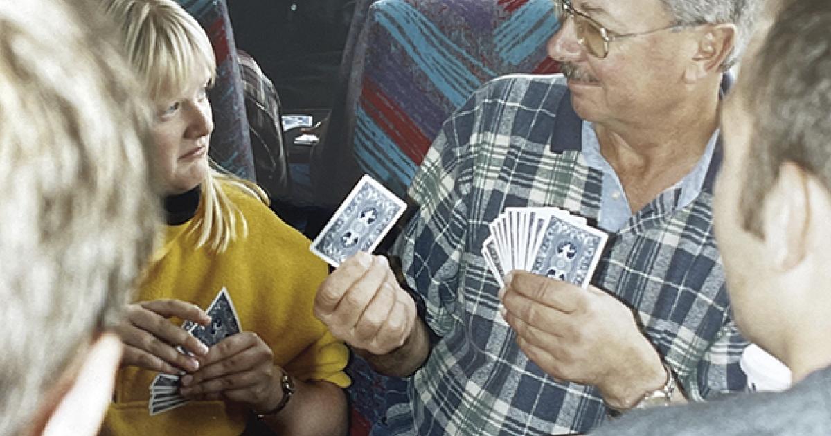 North Dakota Living editor Cally (Musland) Peterson plays pinochle with Farmers Union member Jim Storhoff on the bus ride home from Washington, D.C., following the 9/11 attacks.